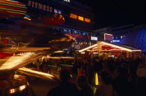 Breitscheidplatz. Christmas Market. Funfair and stalls colourfully Illuminated at night with people gathered around.Deutschland European Nite Religious Western Europe Xmas Religion