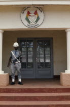 Presidential building La Presidence with armed guard standing outside.