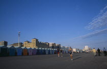 Joggers on Hove Lawns Esplanade by colourful beach huts in late afternoon sunshine.European Great Britain Northern Europe UK United Kingdom British Seaside Shore Tourism Colorful Beaches British Isle...