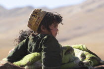 Kuchie nomad camel train  between Chakhcharan and Jam  Children on top of camel