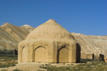 Tomb near empty niche where the famous carved Budda once stood  destroyed by the Taliban in 2001