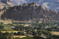 View of Bamiyan valley and village showing cliffs with empty niche where the famous carved Budda once stood  destroyed by the Taliban in 2001