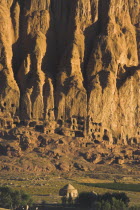 Tomb at base of cliffs near empty niche where the famous carved Budda once stood  destroyed by the Taliban in 2001