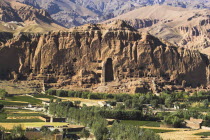 View of Bamiyan valley and village showing cliffs with empty niche where the famous carved Budda once stood  destroyed by the Taliban in 2001