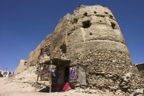 Shop next to the ancient walls of Citadel destroyed during First Anglo Afghan war since rebuilt still used as a military garrisonJane Sweeney