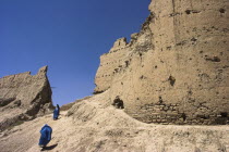 Ladies wearing burqua walk near ancient walls of Citadel destroyed during First Anglo Afghan war since rebuilt still used as a military garrisonJane Sweeney