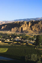 View of Bamiyan valley and village showing cliffs with empty niche where the famous carved Budda once stood  destroyed by the Taliban in 2001