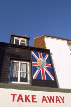 Fish and Chips shop take away frontage with a Union Jack flag sign.