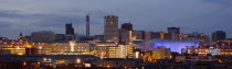 City skyline illuminated in evening light