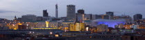 City skyline illuminated in evening light