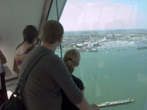 Gunwharf Quay, The Spinnaker Tower. Interior view with visitors looking out of glass windows on the top observation deck  providing a 320¡ view of the city of Portsmouth  the Langstone and Portsmouth...