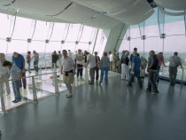 Gunwharf Quay, The Spinnaker Tower. Interior view with visitors looking out of glass windows on the top observation deck  providing a 320¡ view of the city of Portsmouth  the Langstone and Portsmouth...