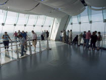 Gunwharf Quay, The Spinnaker Tower. Interior view with visitors looking out of glass windows on the top observation deck  providing a 320¡ view of the city of Portsmouth  the Langstone and Portsmouth...