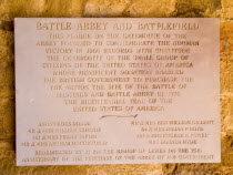 Battle Abbey. Battlefield Plaque on stone wall by the gatehouse