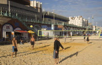 People playin beach volleyball on the seafront outside the Grand Hotel.European Beaches Great Britain Northern Europe Resort Sand Sandy Seaside Shore Tourism UK United Kingdom