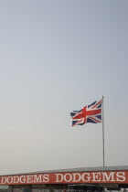 Harbour Park Dodgems amusement ride with detail of sign and Union Jack Flag flying from roof