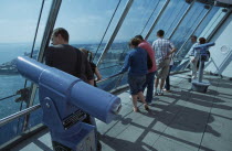 Gunwharf Quay, The Spinnaker Tower. Interior at top of tower on the observation deck with visitors looking out of glass windows providing a 320¡ view of the city of Portsmouth  the Langstone and Portsmouth harbours  and a viewing distance of 37 kilometres  23 miles