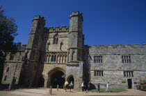 Battle Abbey. Partially ruined abbey complex. The Gatehouse seen from interior courtyard with visitors walking through