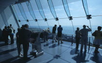 Gunwharf Quay, The Spinnaker Tower. Interior with visitors looking out of glass windows on the top observation deck  providing a 320¡ view of the city of Portsmouth  the Langstone and Portsmouth harb...