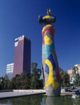 Parc Joan Miro  Dona I Ocell.  Woman and Bird sculpture by Miro  high rise buildings beyond.