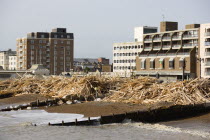 Timber washed up on the beach from the Greek registered Ice Princess which sank off the Dorset coast on 15th January 2008. Wood sits between groynes above the high water mark with seafront flats beyon...