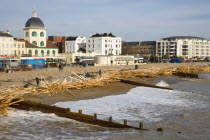 Timber washed up on the beach from the Greek registered Ice Princess which sank off the Dorset coast on 15th January 2008. Wood sits above the high water mark beyond the groynes in front of seafront b...