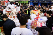 Lion Dance troupe performing in Gerrard Street with onlooking crowd during Chinese New Year celebrations in 2006 for the coming Year of The Dog