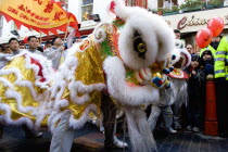 Lion Dance troupe performing in Gerrard Street with onlooking crowd during Chinese New Year celebrations in 2006 for the coming Year of The Dog