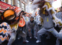 Lion Dance troupe performing in Gerrard Street with onlooking crowd during Chinese New Year celebrations in 2006 for the coming Year of The Dog.