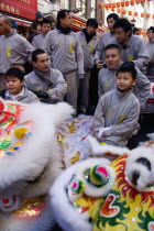 Lion Dance troupe in Gerrard Street with their lions before performing through the area during Chinese New Year celebrations in 2006 for the coming Year of The Dog