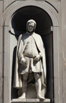 ITALY, Tuscany, Florence, Statue of architect and painter Giotto di Bondone in the Vasari Corridor outside the Uffizi.