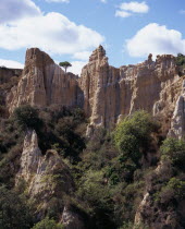 Ille Sur Tet.  Sandstone area known as Orgues.  Eroded pinnacles of sandstone rock rising above trees.