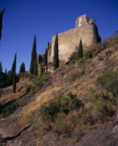 Chateaux de Lastours  Cathar castles.  Chateau Cabaret dating from the mid-eleventh century set on hillside with cypress trees.