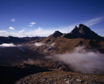 Pic du Midi d Ossau  2884 m  from Col du Pourtalet and mist drifting across valley in foreground.