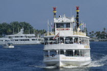 Jungle Queen Paddlesteamer traveling along waterway