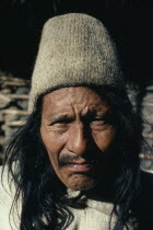 Portrait of Ika man wearing traditional fique cactus fibre finely woven hat and woven wool and cotton cloak.Arhuaco Aruaco indigenous tribe American Classic Classical Colombian Columbia Hispanic Hist...