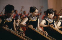 Altai Provincial Orchestra musicians playing Mongolian national music on traditional stringed instruments.East Asia Asian Mongol Uls