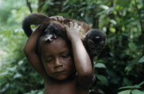 Portrait of young Makuna child with pet monkey.Tukano  Makuna Indian North Western Amazonia American Children Colombian Columbia Hispanic Indegent Kids Latin America Latino South America Tukano