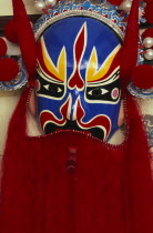 Huguang Guildhall.  Bright red  blue  yellow and black opera mask.