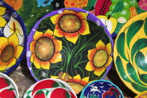 Colourful plates and bowls for sale