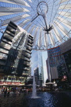 Potsdamer Platz interior with crowds gathered around water fountain