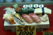 Window display of plastic sushi.