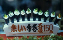 Window display of plastic sushi.