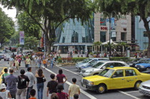 People crossing busy street.