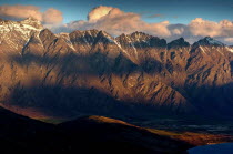 QUEENSTOWN  SHADOWS OF CLOUDS UPON THE REMARKABLES MOUNTAIN RANGE FROM THE SKYLINE RESTAURANT CAFE AND GONDOLA COMPLEX ABOVE QUEENSTOWN AT SUNSET.Antipodean Oceania Bar Bistro Scenic White