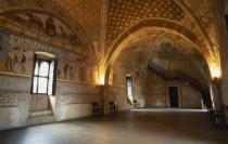 Angera.  Interior of reception hall in Rocca di Angera medieval castle with painted vaulted ceiling and fresco wall decoration.