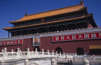 Entrance gateway to the Forbidden City from Tiananmen Square with portrait of Mao on exterior wall.