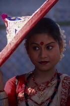 Portrait of female dancer with conical hat at the Jaipur Heritage Festival