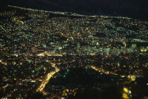 Illuminated cityscape at night.