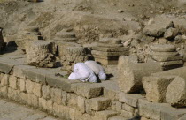 Two muslim men pray towrds Mecca.